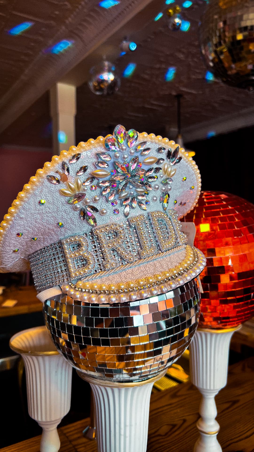 Rhinestone Bride cap on a disco ball