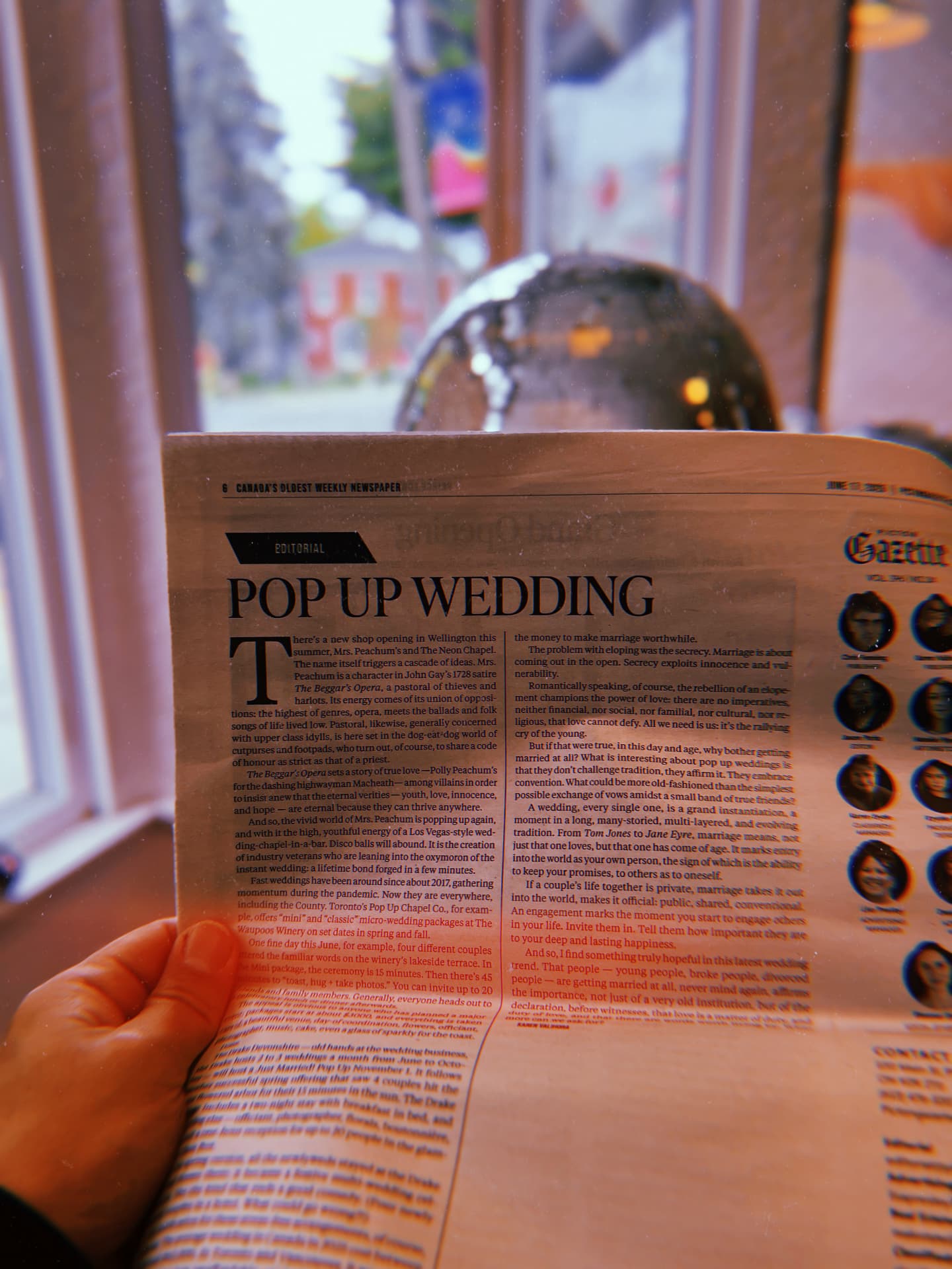 Newspaper article titled Pop Up Wedding read by a window